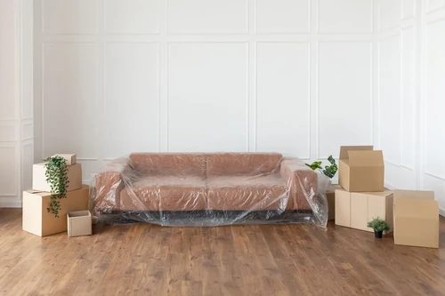 A couch and other pieces of furniture prepped for storage.